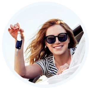 woman in a car holding car keys