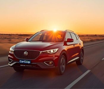 MG ZS driving on Australian highway with sunset background